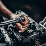 Mechanic working on car diesel engine
