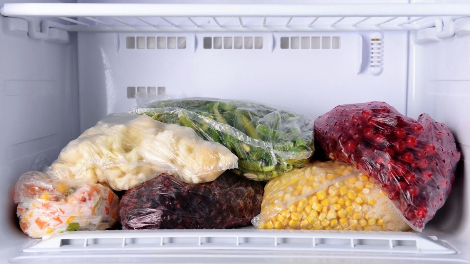 A deep freezer with packets of food