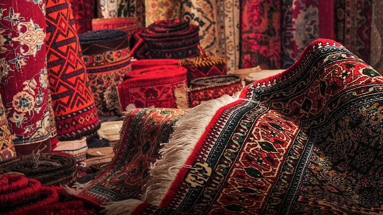 An assortment of beautiful red Persian snug carpet
